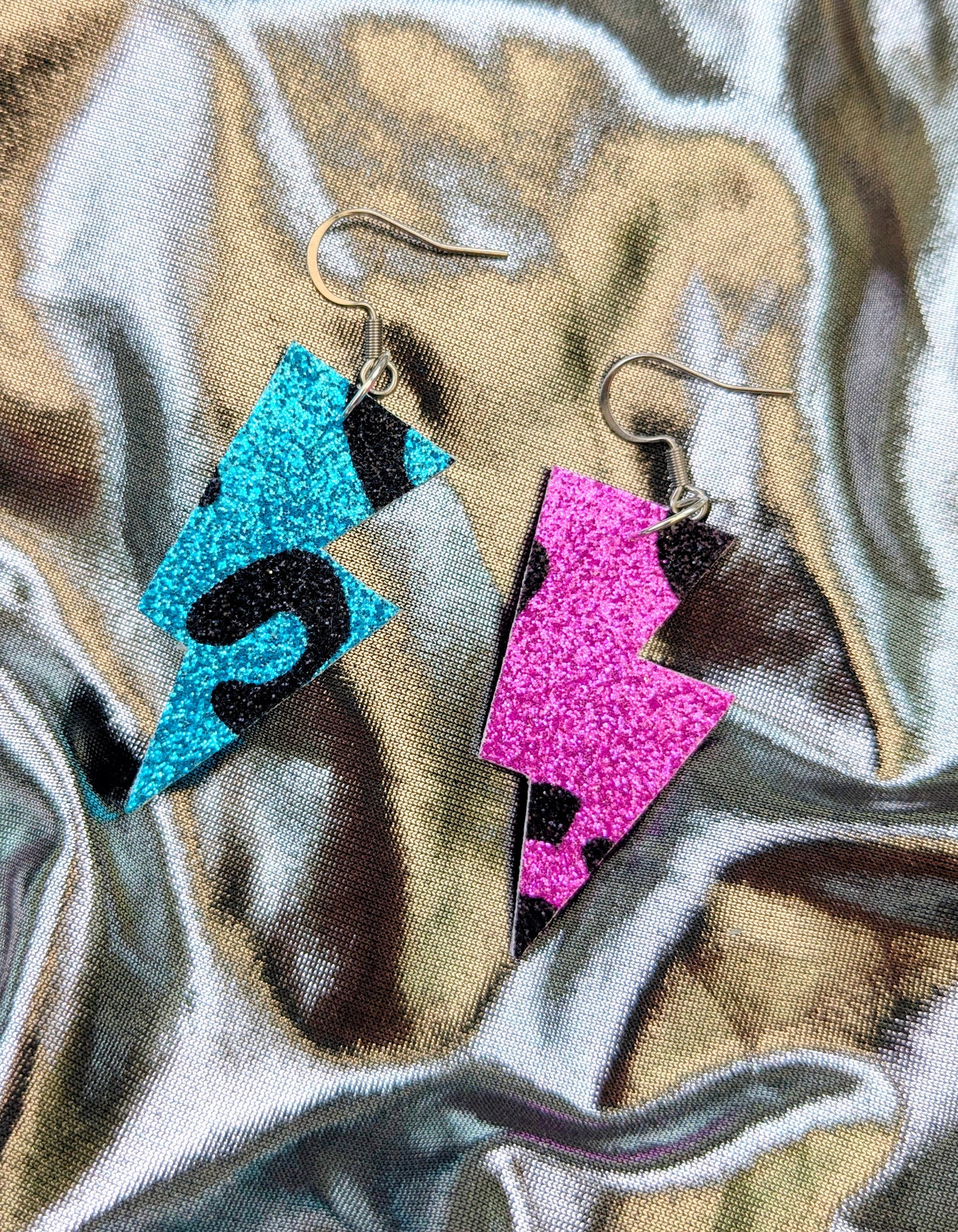 Small leopard print lightning bolt dangle earrings in pink and turquoise